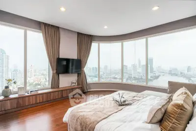 Luxurious bedroom with panoramic city view and elegant decor