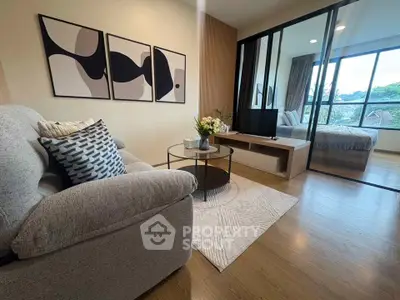 Modern living room with stylish decor and large window view