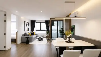 Modern open-plan living and dining area with stylish decor and natural light.
