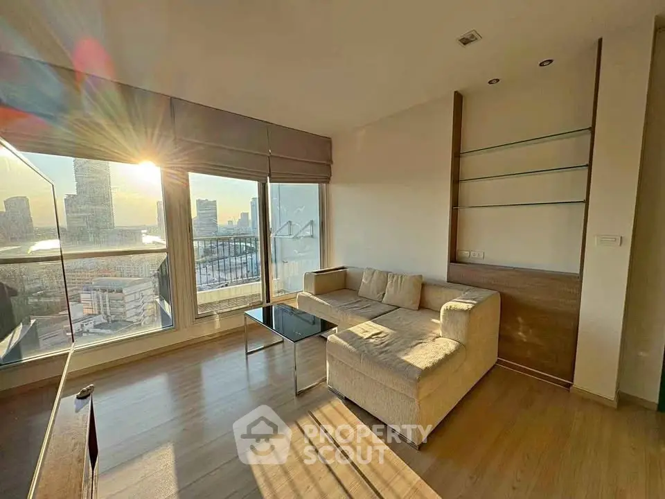 Sunlit modern living room with city view and cozy corner sofa