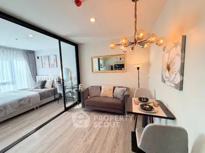 Modern open-plan living room with elegant decor and cozy dining area
