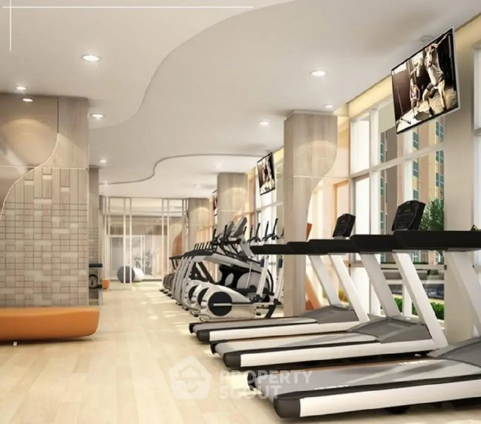 Modern gym with state-of-the-art equipment and stylish interior design in luxury apartment building.