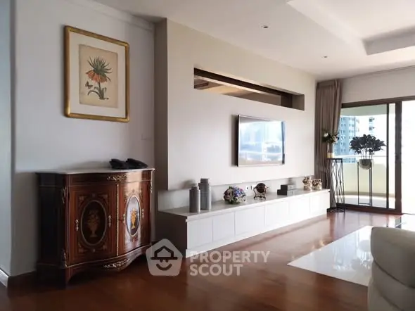 Elegant living room with modern decor and balcony view