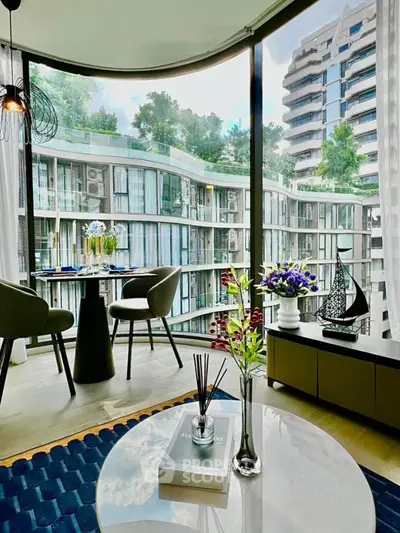 Luxurious modern living room with stunning city view and elegant decor