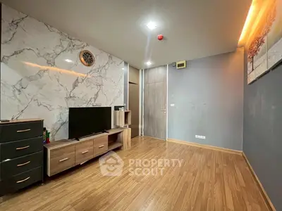 Modern living room with marble accent wall and wooden flooring
