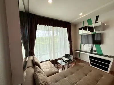 Modern living room with stylish decor and large window view