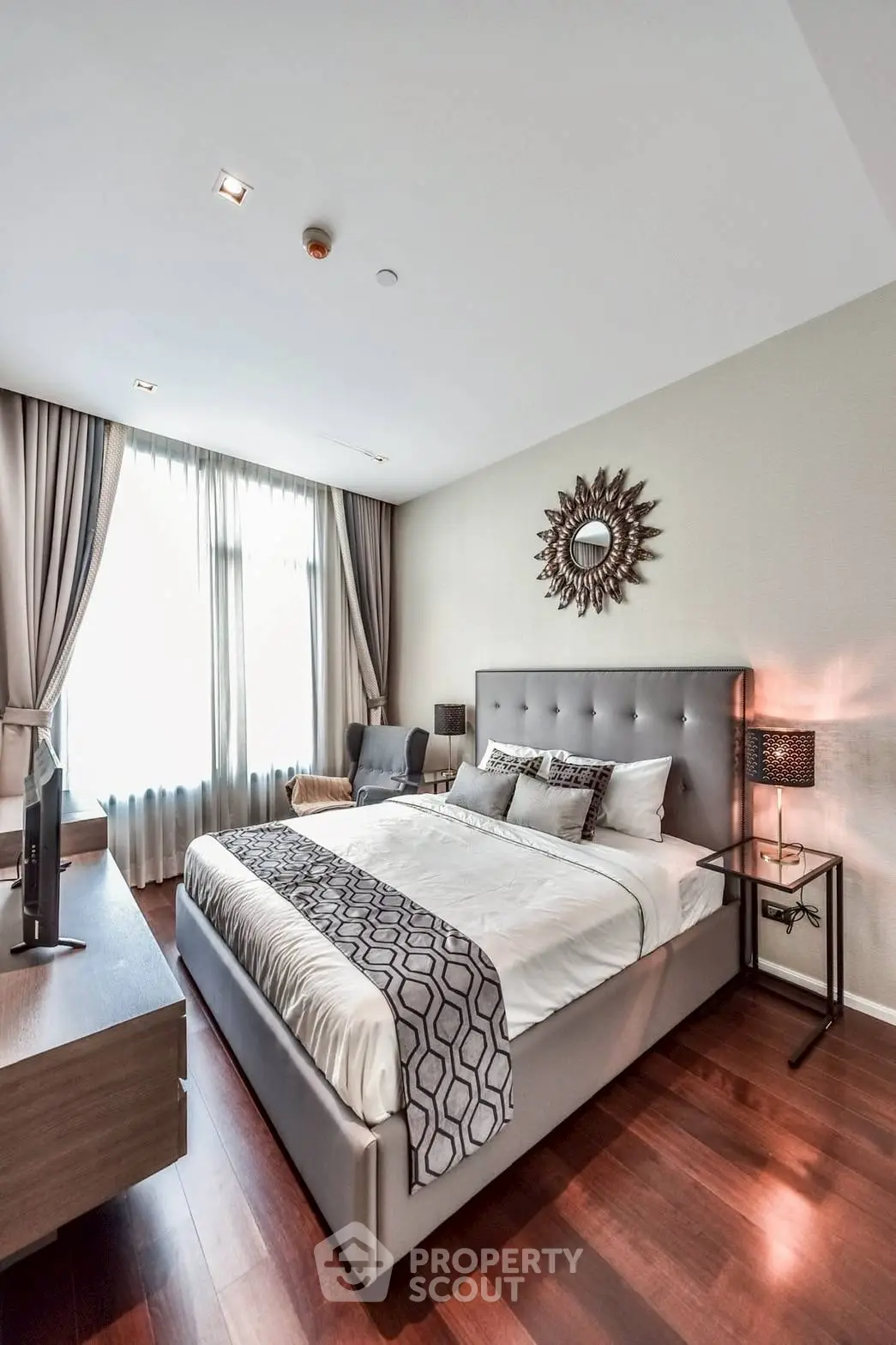 Luxurious bedroom with elegant decor and natural light