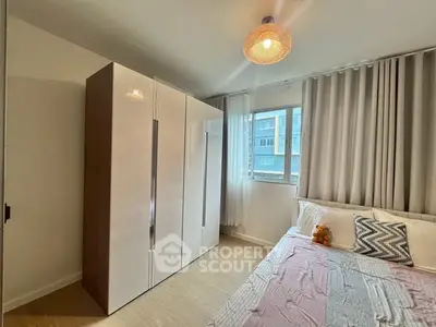 Cozy bedroom with modern wardrobe and natural light