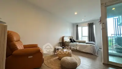 Cozy bedroom with modern decor and balcony access in a stylish apartment.