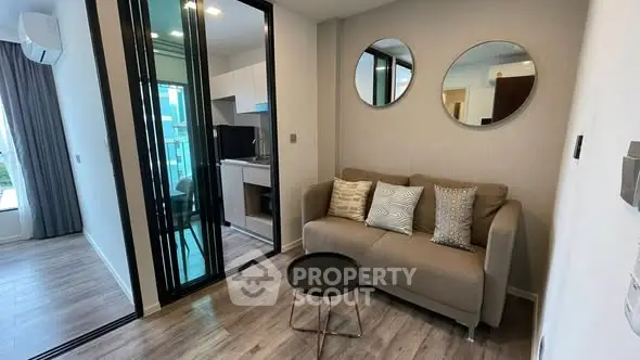 Modern living room with stylish decor and open kitchen layout