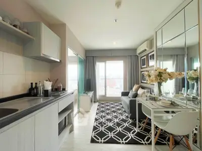 Modern living room with stylish decor and open kitchen layout