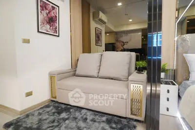 Modern living room with stylish sofa and elegant decor in a cozy apartment setting.
