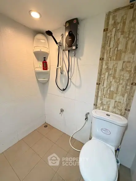 Modern bathroom with shower and water heater in a compact space