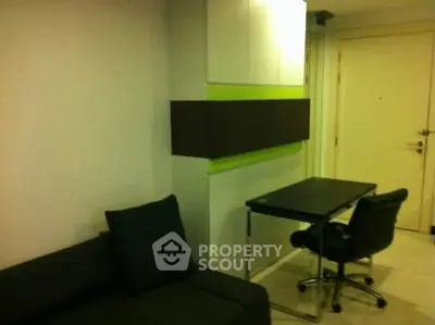 Modern study area with sleek desk and chair in a stylish apartment.