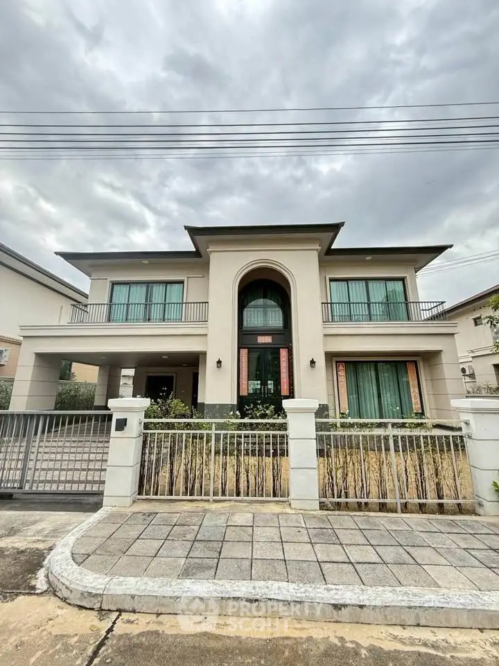 Stunning modern two-story house with elegant facade and large windows, perfect for luxurious living.