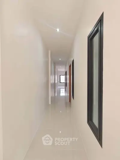 Bright and spacious hallway with modern design and sleek finishes in a contemporary property.