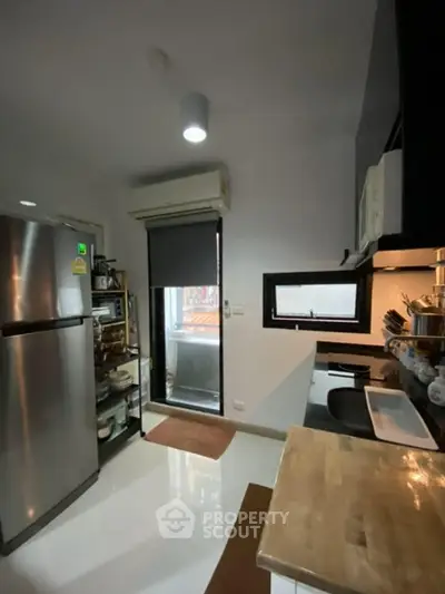 Modern kitchen with sleek appliances and open layout design