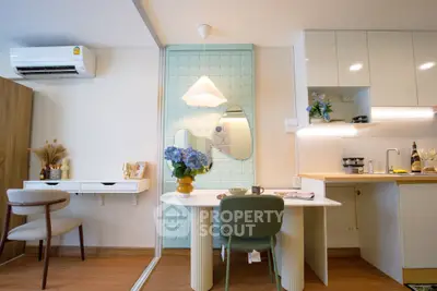 Chic modern living space with stylish dining area and compact kitchen, perfect for urban living.