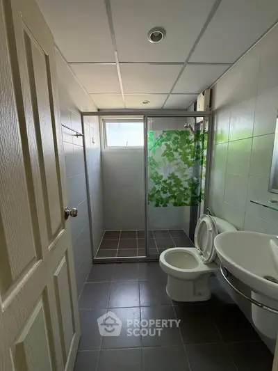 Modern bathroom with shower enclosure and sleek tile design