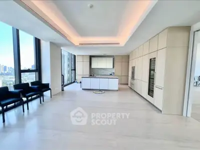 Spacious modern kitchen with sleek cabinetry and panoramic city views.