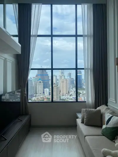 Luxurious living room with stunning city view through large windows, modern decor and cozy seating.