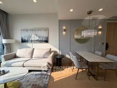 Modern living room with elegant dining area and stylish decor