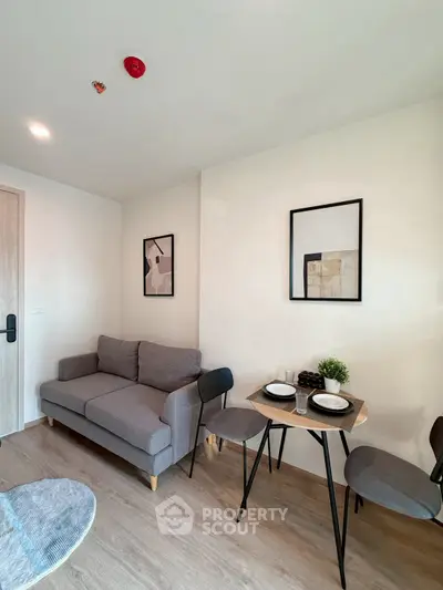 Modern living room with cozy sofa and dining area in stylish apartment