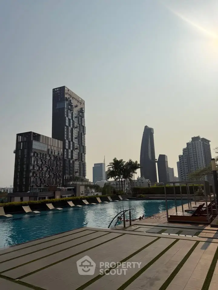 Luxurious urban poolside with stunning city skyline view, modern high-rise buildings, and serene atmosphere.