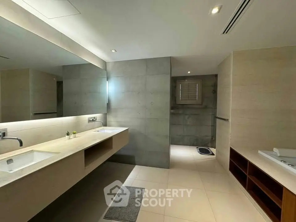 Spacious modern bathroom with dual sinks and elegant design