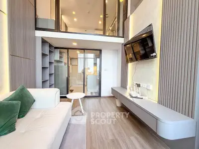 Modern living room with mezzanine, sleek design, and stylish furnishings in a contemporary apartment.