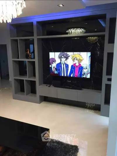 Modern living room with sleek entertainment center and TV display