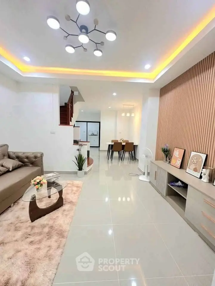 Modern living room with stylish decor, open layout, and elegant lighting, perfect for contemporary living.