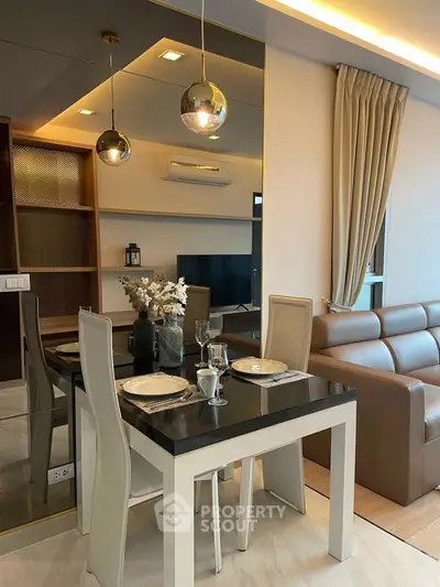 Modern living room with elegant dining area and stylish decor