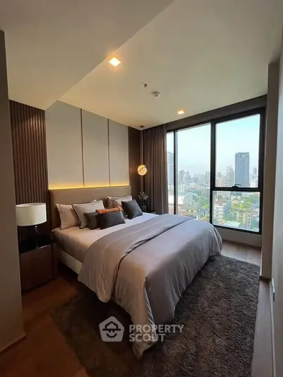 Luxurious bedroom with stunning city view and elegant decor