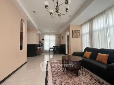 Spacious living room with elegant decor and ample natural light