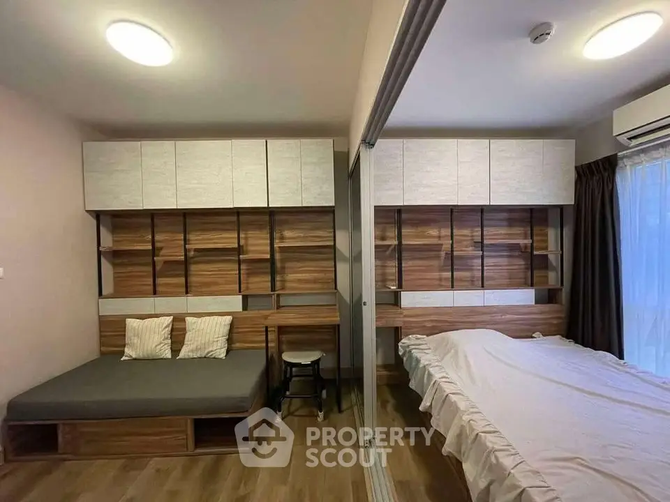 Modern bedroom with stylish wood paneling and cozy lighting
