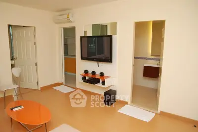 Modern living room with wall-mounted TV and stylish furniture