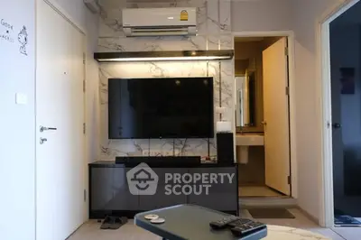 Modern living room with sleek TV setup and marble accent wall