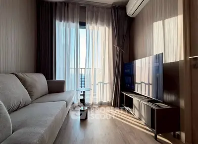 Modern living room with sleek furniture and large window view