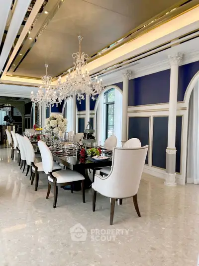 Luxurious dining room with elegant chandelier and opulent decor, perfect for sophisticated gatherings.