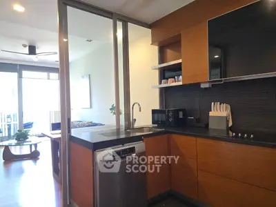 Modern kitchen with sleek appliances and open layout in stylish apartment