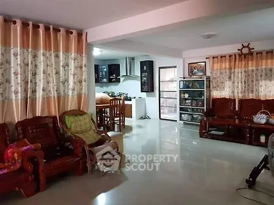 Spacious living room with elegant wooden furniture and open kitchen layout