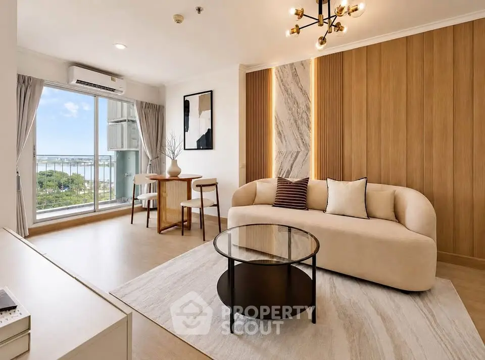 Modern living room with elegant decor and stunning view, featuring a cozy sofa and stylish lighting.