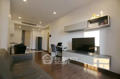 Modern living room with sleek furniture and natural light, perfect for urban living.