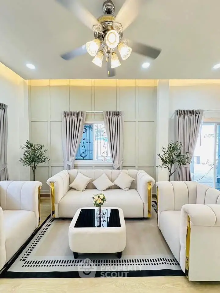 Luxurious living room with elegant white sofas and modern decor