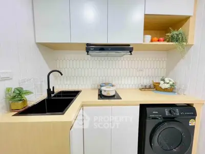 Modern compact kitchen with sleek design and integrated appliances