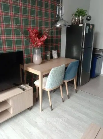 Chic modern kitchen with stylish dining area and stainless steel fridge
