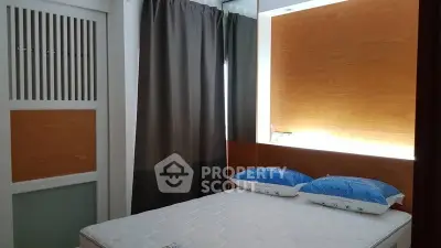 Modern bedroom with stylish decor and cozy ambiance, featuring a comfortable bed and elegant curtains.