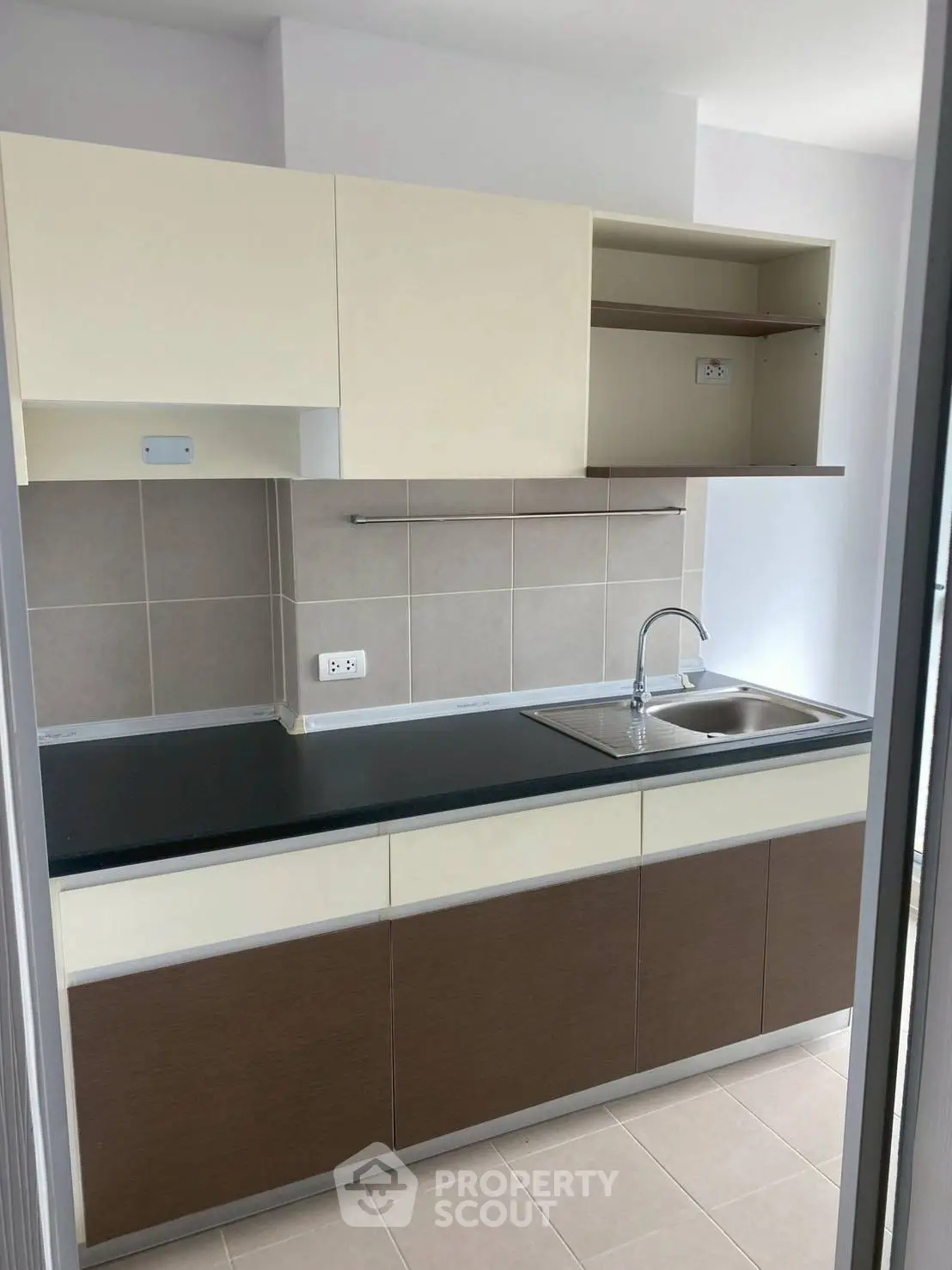 Modern kitchen with sleek cabinetry and stainless steel sink