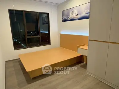 Modern minimalist bedroom with city view and sleek wooden furniture.